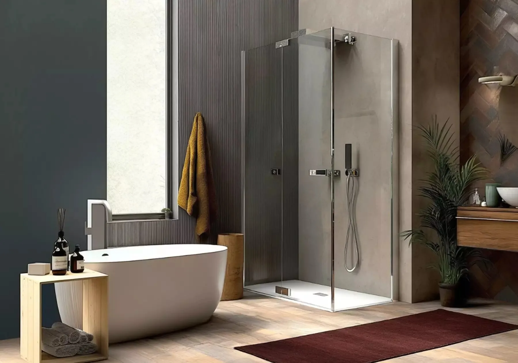 Box doccia CSA accanto a una vasca freestanding